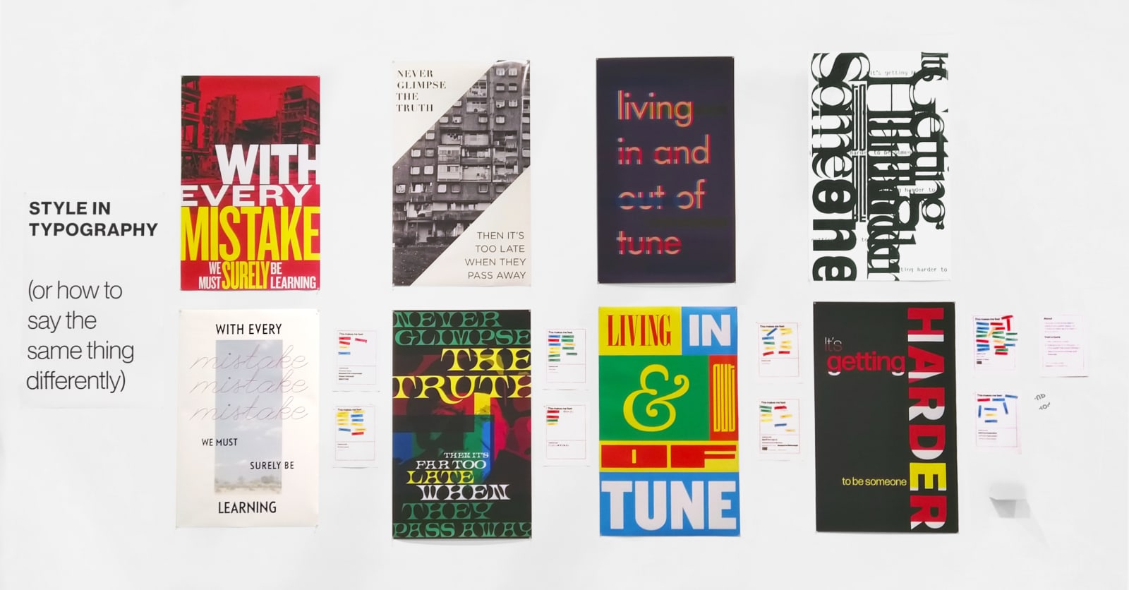 the exhibit setup. 8 posters are arranged in a grid. North-American-Letter sized pages are placed next to each poster for gathering public reponse.